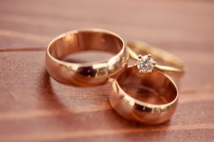 Beautiful golden engagement and wedding rings